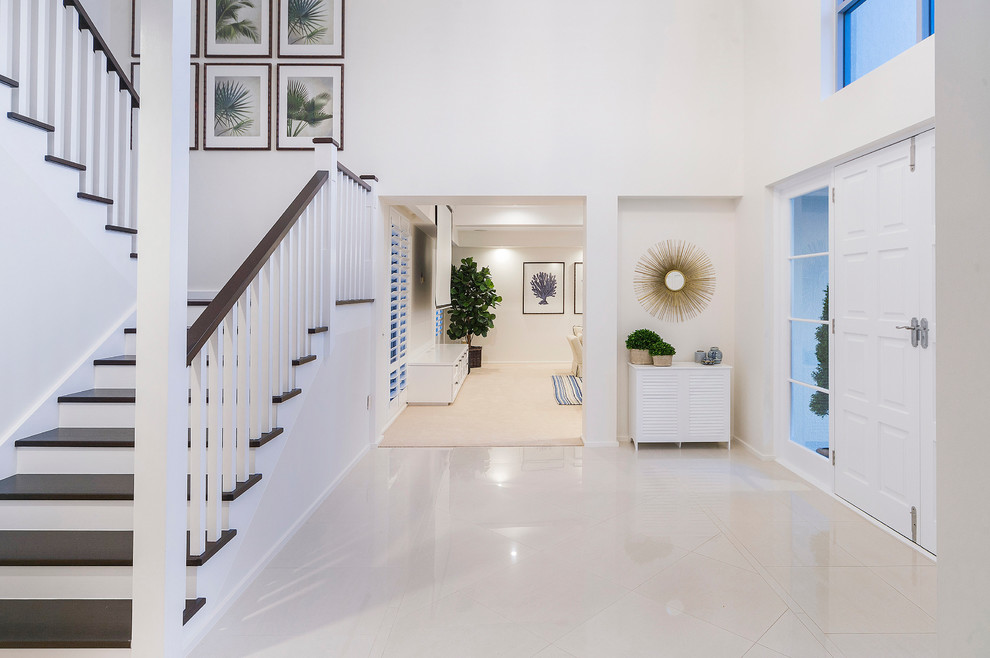 This is an example of a beach style foyer in Brisbane.