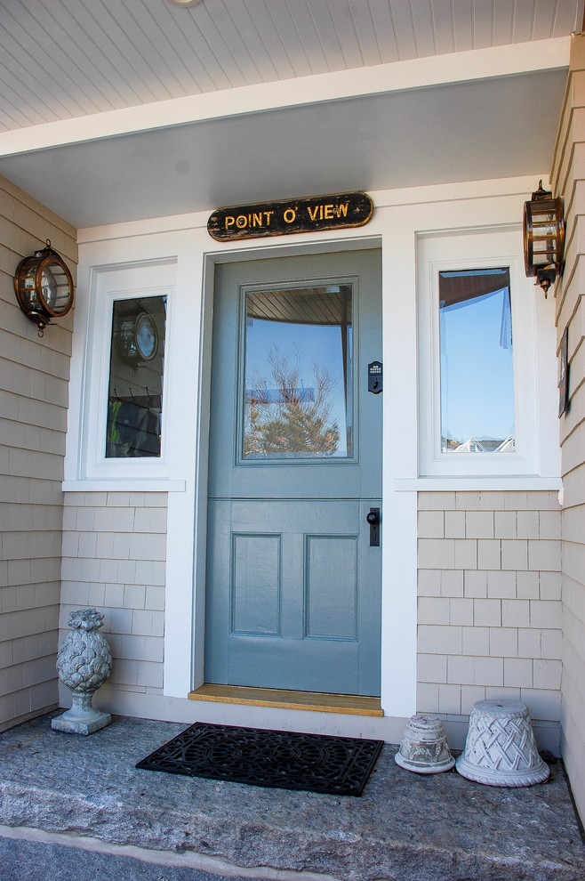 Traditional entryway in Boston with a dutch front door.
