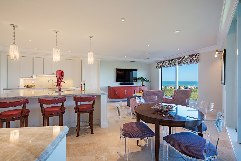 Inspiration for a transitional u-shaped beige floor open concept kitchen remodel in Miami with recessed-panel cabinets, white cabinets, marble countertops, beige backsplash and an island