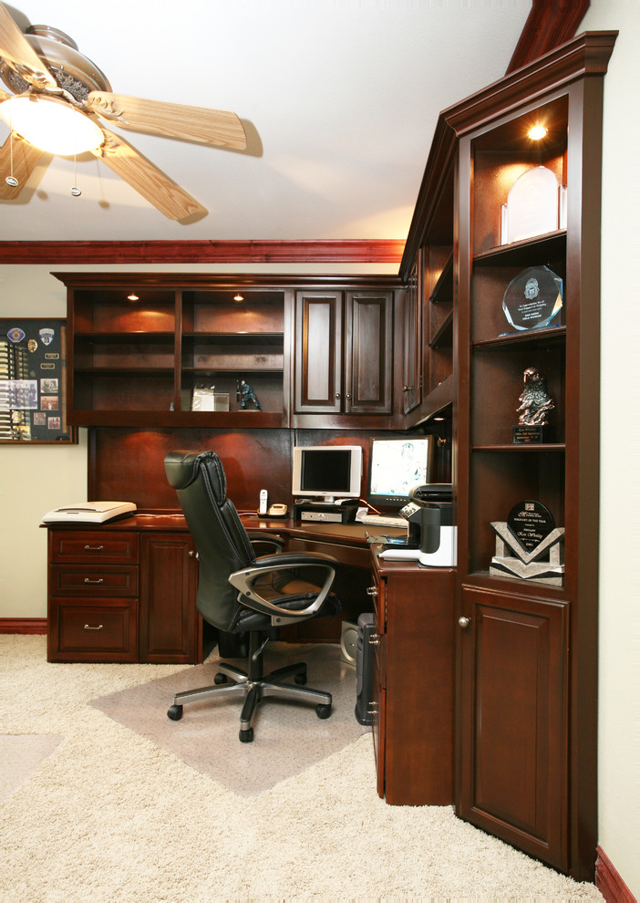 This is an example of a mid-sized traditional home studio in Orange County with white walls, carpet and a freestanding desk.