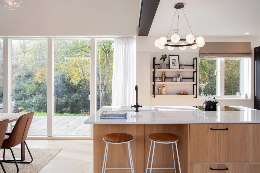 Small contemporary single-wall open plan kitchen in Hertfordshire with an island.