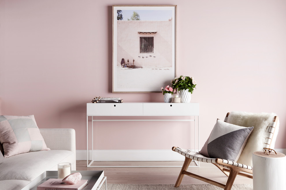 This is an example of a scandinavian living room in Melbourne with pink walls.