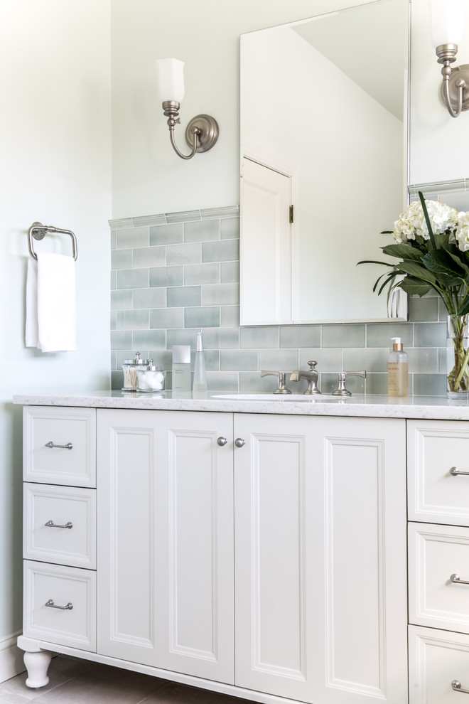 Design ideas for a transitional master bathroom in Boston with recessed-panel cabinets, white cabinets, a freestanding tub, a curbless shower, a one-piece toilet, green tile, ceramic tile, marble floors, an undermount sink, marble benchtops, grey floor, an open shower and grey benchtops.