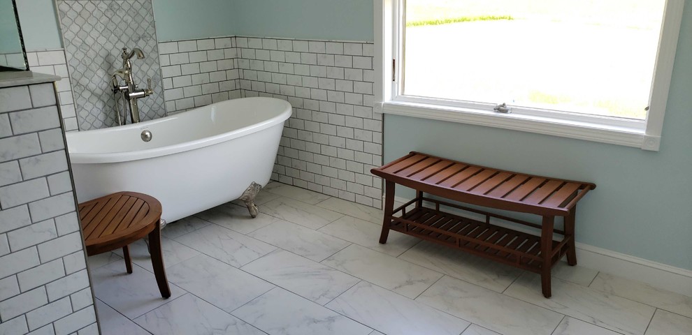 Photo of a mid-sized modern master bathroom in Boston with shaker cabinets, white cabinets, a claw-foot tub, an open shower, a two-piece toilet, multi-coloured tile, porcelain tile, blue walls, porcelain floors, an undermount sink, quartzite benchtops, multi-coloured floor, a hinged shower door and multi-coloured benchtops.