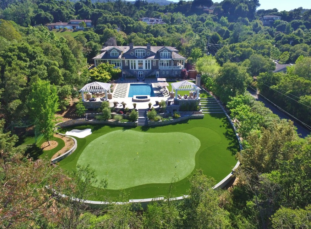Example of a large trendy backyard stone and custom-shaped pool design in San Francisco