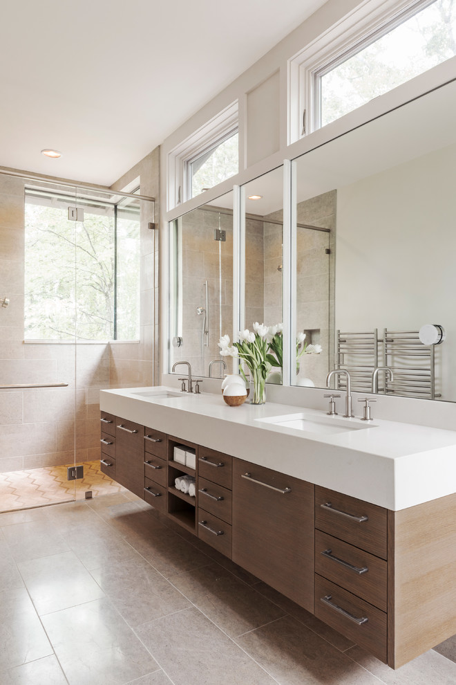 Large country master bathroom in Charlotte with flat-panel cabinets, medium wood cabinets, a curbless shower, beige tile, limestone, limestone floors, an undermount sink, engineered quartz benchtops, beige floor and a hinged shower door.
