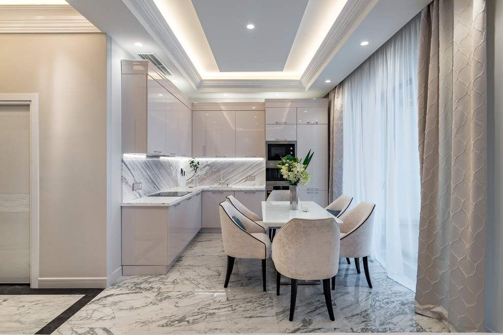 This is an example of a contemporary l-shaped kitchen in Moscow with an undermount sink, flat-panel cabinets, beige cabinets, multi-coloured splashback, panelled appliances, marble floors, no island, grey floor and grey benchtop.