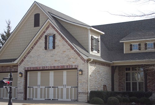 Inspiration for a large traditional two-storey beige exterior in Other with a gable roof.