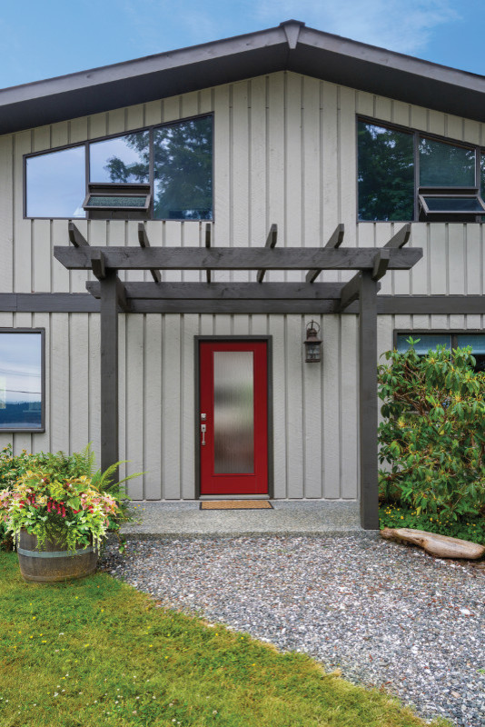 Front door - eclectic front door idea with a red front door