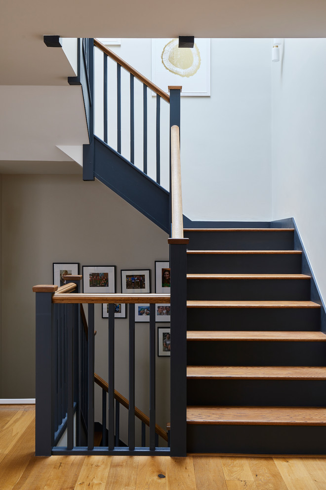 This is an example of a large contemporary staircase in Surrey.