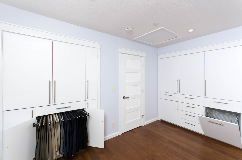 This is an example of a modern storage and wardrobe in San Francisco with recessed-panel cabinets.