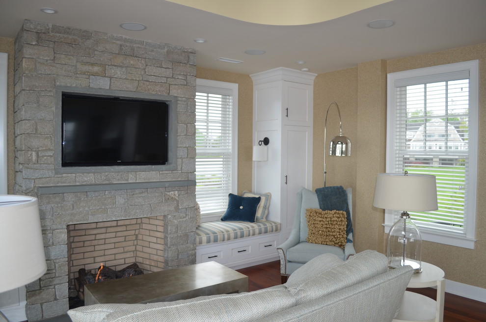 Design ideas for a small beach style open concept family room in Other with dark hardwood floors, a game room, beige walls, a standard fireplace, a stone fireplace surround and a built-in media wall.
