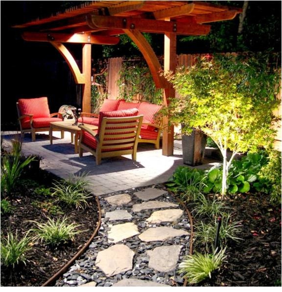 Patio - mid-sized transitional backyard brick patio idea with a pergola