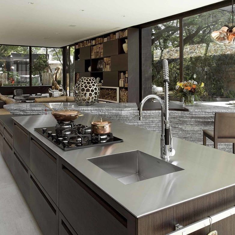 This is an example of a mid-sized contemporary u-shaped eat-in kitchen in San Francisco with an undermount sink, flat-panel cabinets, beige cabinets, quartz benchtops, beige splashback, stone slab splashback, stainless steel appliances, porcelain floors, with island, white floor and brown benchtop.