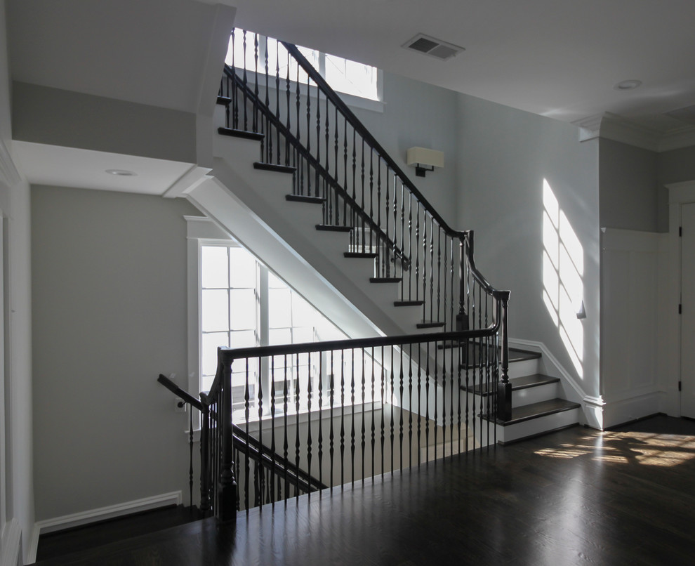 Inspiration for a large transitional wooden l-shaped mixed material railing staircase remodel in DC Metro with painted risers