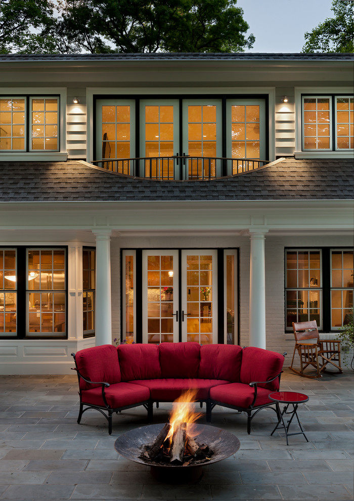Inspiration for a traditional backyard patio in DC Metro with a fire feature and no cover.