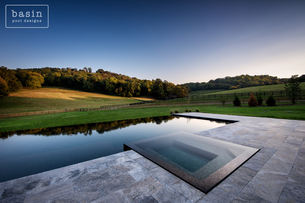 Hot tub - large transitional backyard stone and custom-shaped infinity hot tub idea in Nashville
