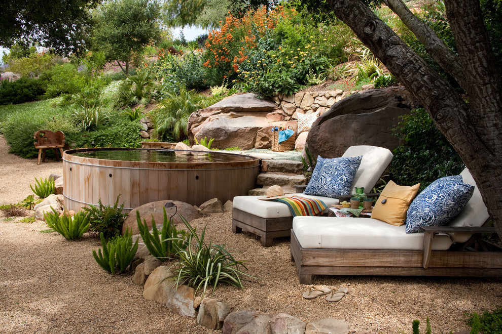 Photo of a large transitional backyard full sun garden in Santa Barbara with gravel.