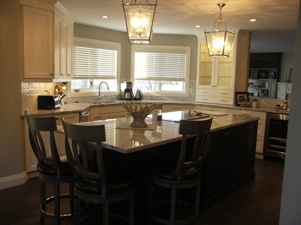 Mid-sized transitional u-shaped medium tone wood floor and brown floor eat-in kitchen photo in Edmonton with recessed-panel cabinets, white cabinets, an undermount sink, stainless steel appliances, an island, marble countertops, gray backsplash and matchstick tile backsplash