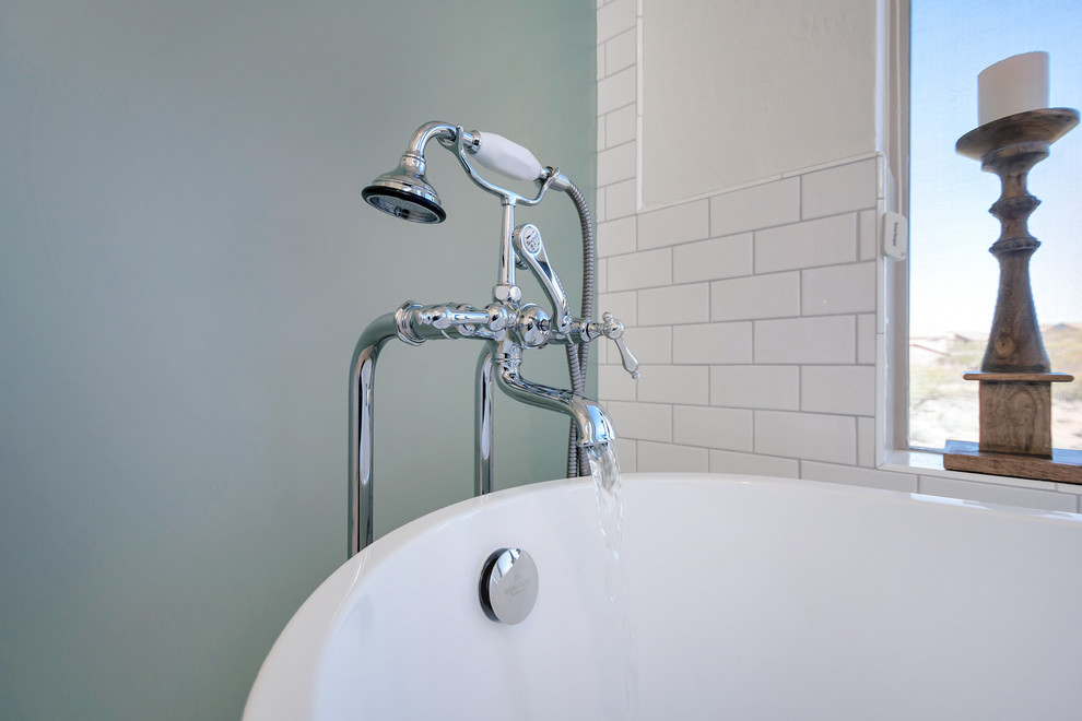 Inspiration for a mid-sized transitional master white tile and subway tile porcelain tile and white floor freestanding bathtub remodel in Phoenix with a hinged shower door