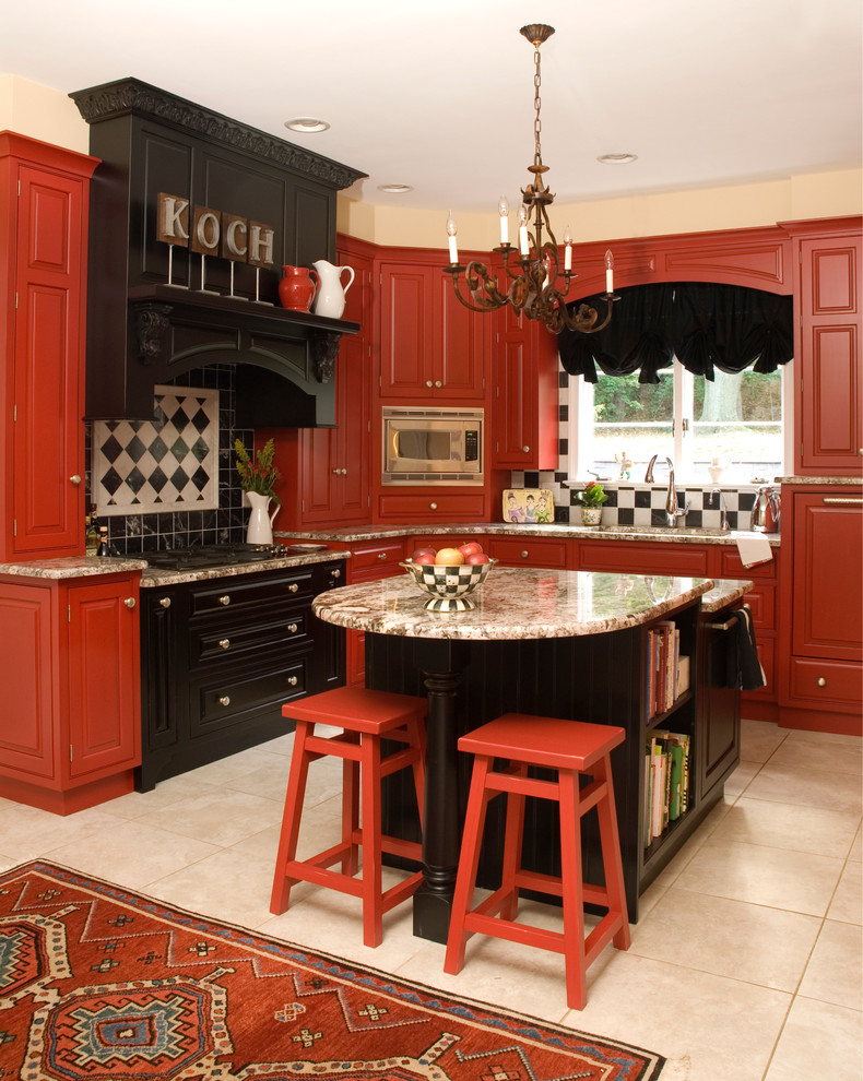 Photo of a traditional kitchen in Baltimore with red cabinets, raised-panel cabinets, multi-coloured splashback and stainless steel appliances.