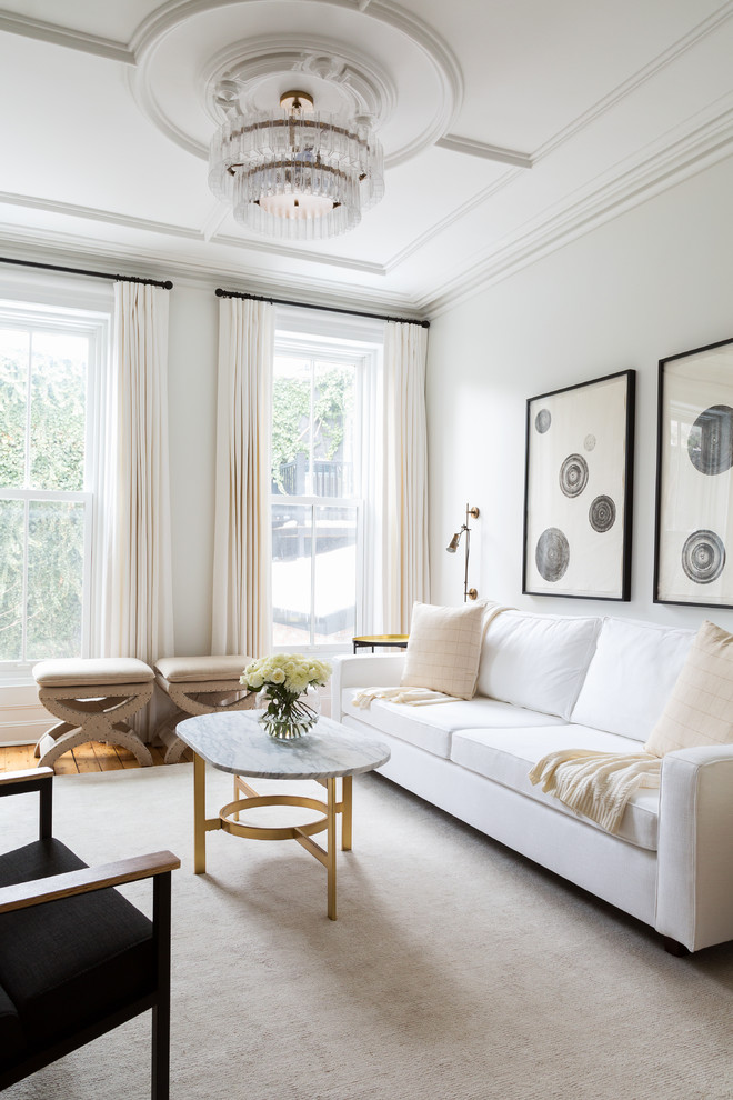 This is an example of a mid-sized transitional formal open concept living room in New York with white walls.