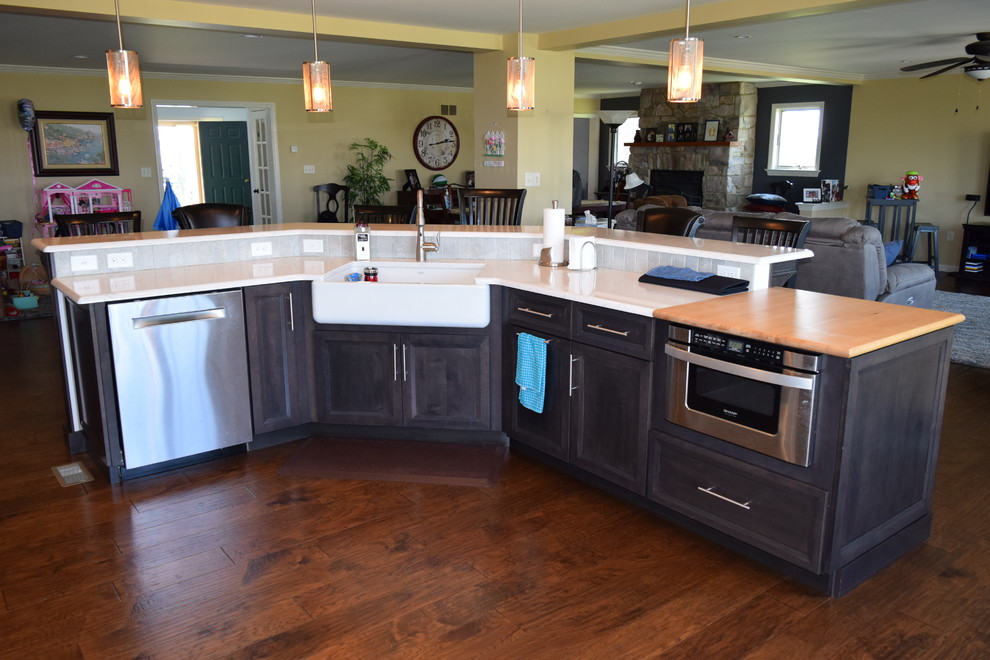 Kitchen - transitional medium tone wood floor kitchen idea with an undermount sink, louvered cabinets, white cabinets, quartz countertops, gray backsplash, ceramic backsplash and stainless steel appliances