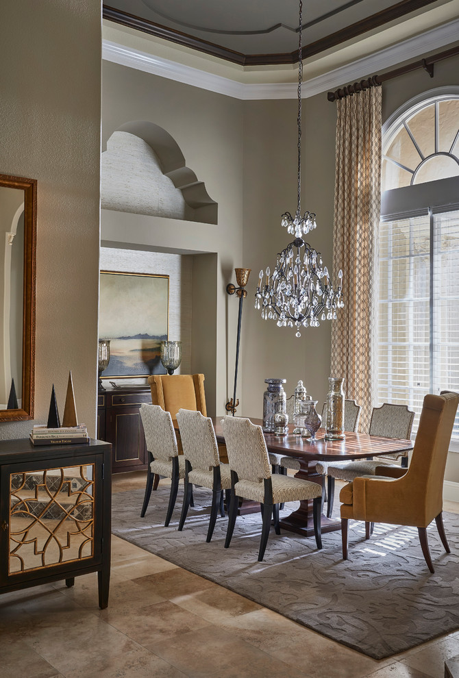 This is an example of a traditional dining room in Orlando with grey walls and marble floors.
