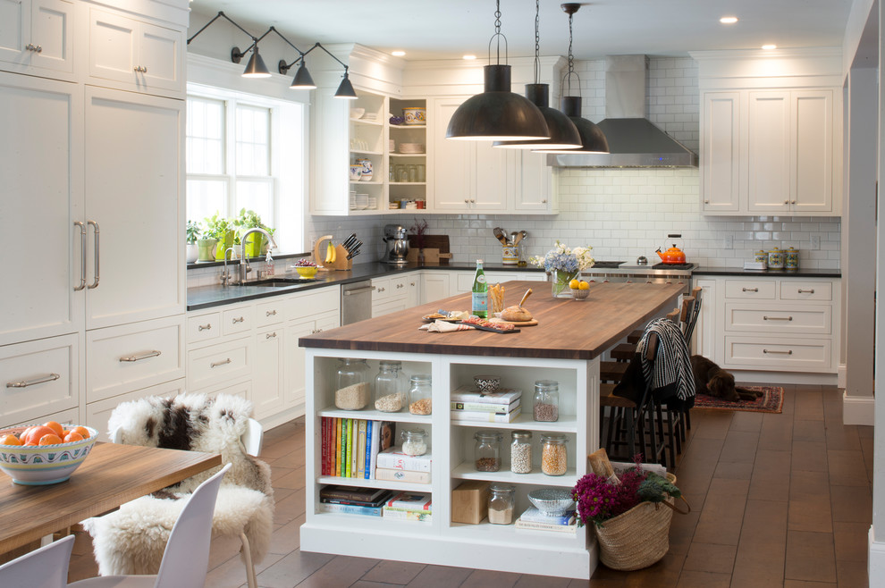 Eat-in kitchen - large transitional l-shaped dark wood floor and brown floor eat-in kitchen idea in Burlington with a single-bowl sink, shaker cabinets, white cabinets, soapstone countertops, white backsplash, ceramic backsplash, stainless steel appliances, an island and black countertops