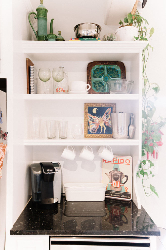 Example of a large transitional single-wall eat-in kitchen design in Nashville with granite countertops and an island