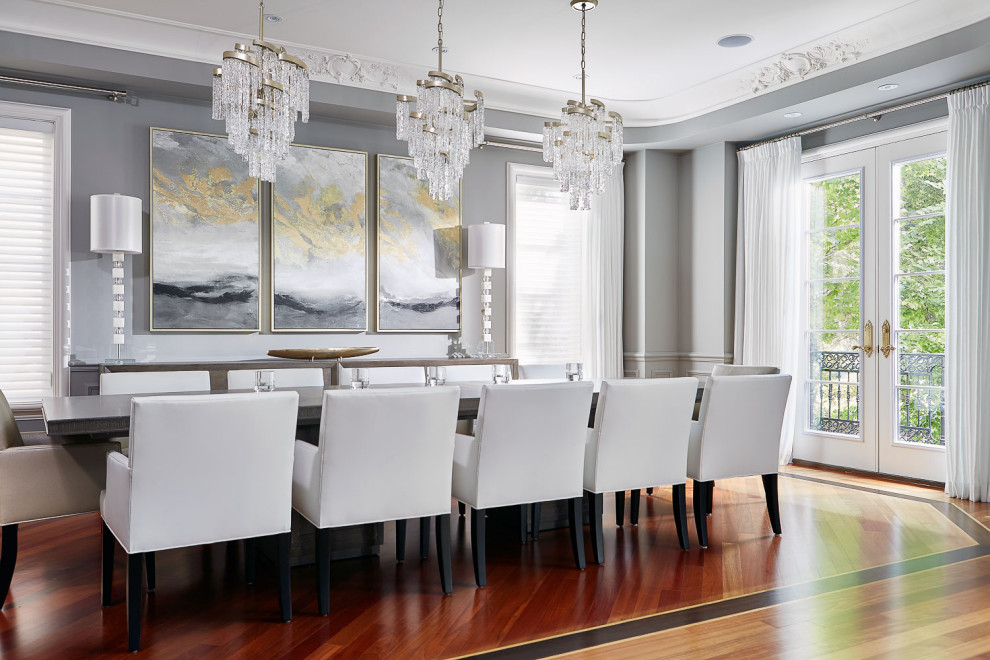 Photo of a large traditional enclosed dining room in Toronto with grey walls and medium hardwood flooring.