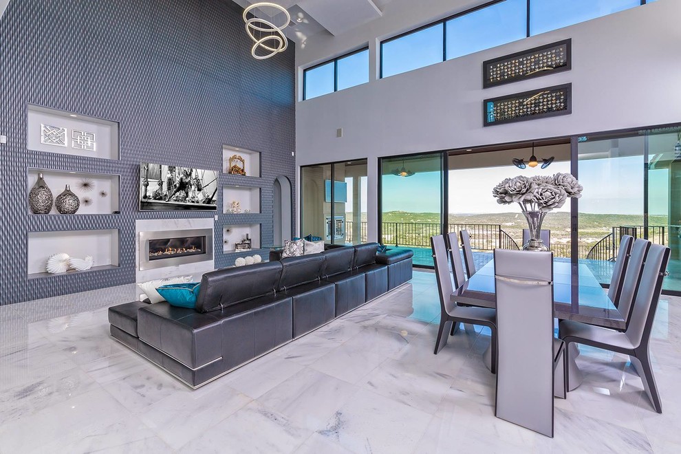Design ideas for an expansive contemporary kitchen/dining combo in Austin with grey walls, marble floors, a ribbon fireplace and a metal fireplace surround.