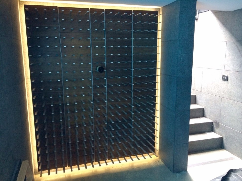 Photo of a large modern wine cellar in San Francisco with display racks.