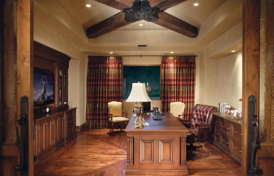 Inspiration for a large traditional study room in Phoenix with beige walls, medium hardwood floors, no fireplace and a freestanding desk.