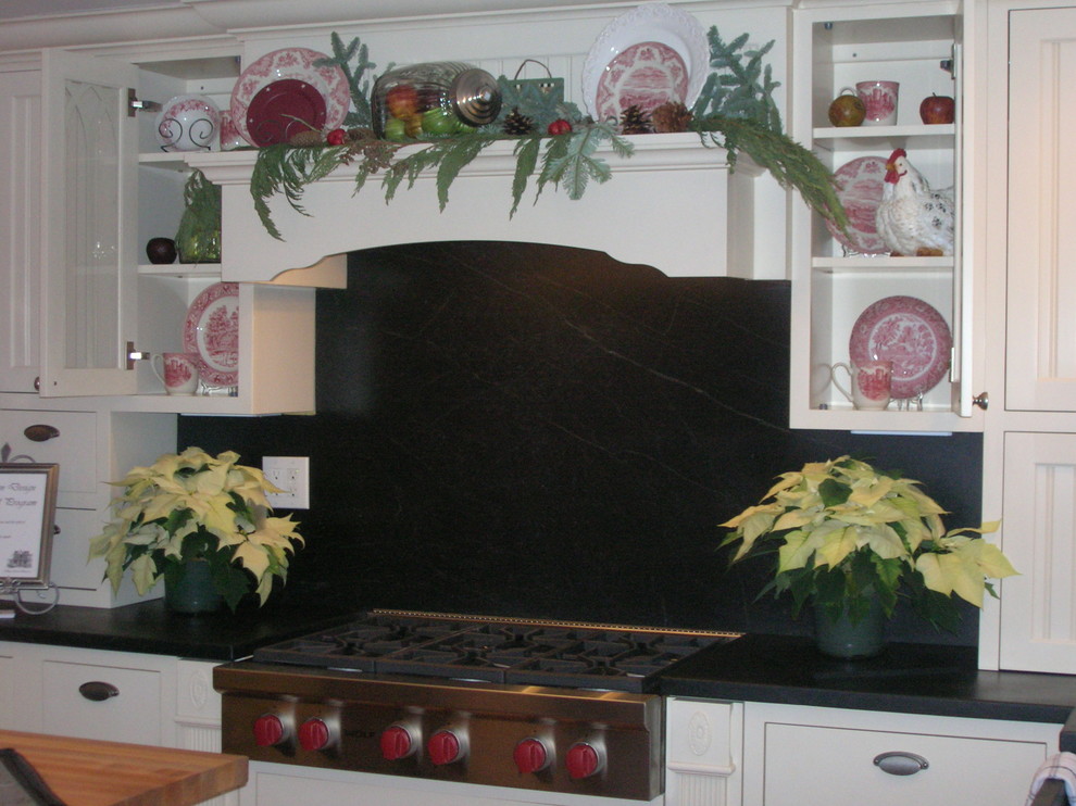 This is an example of a country kitchen in Manchester.