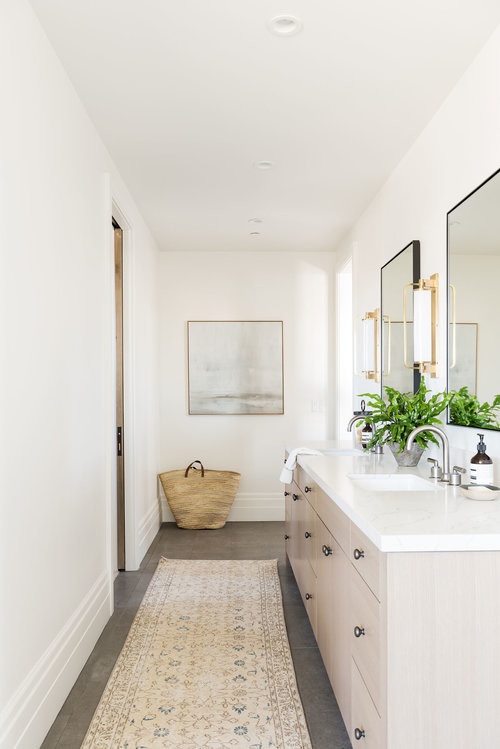 Photo of a large transitional master bathroom in Salt Lake City with light wood cabinets, a freestanding tub, a corner shower, white walls, ceramic floors, marble benchtops, grey floor, a hinged shower door and multi-coloured benchtops.