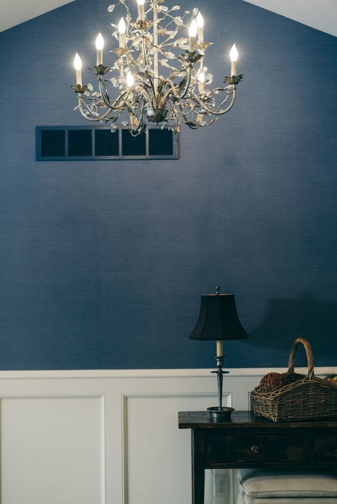 Foyer - mid-sized light wood floor and brown floor foyer idea with blue walls and a brown front door