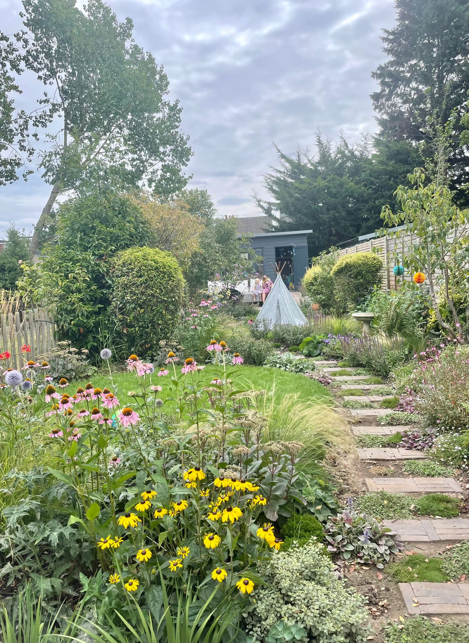 Creation of a clay paver terrace with DesignClad raised beds