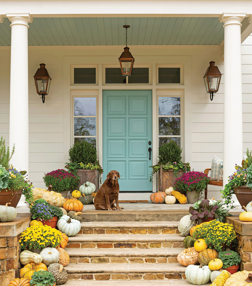 Photo of a large traditional front door in New Orleans with white walls, a single front door, a blue front door and timber.