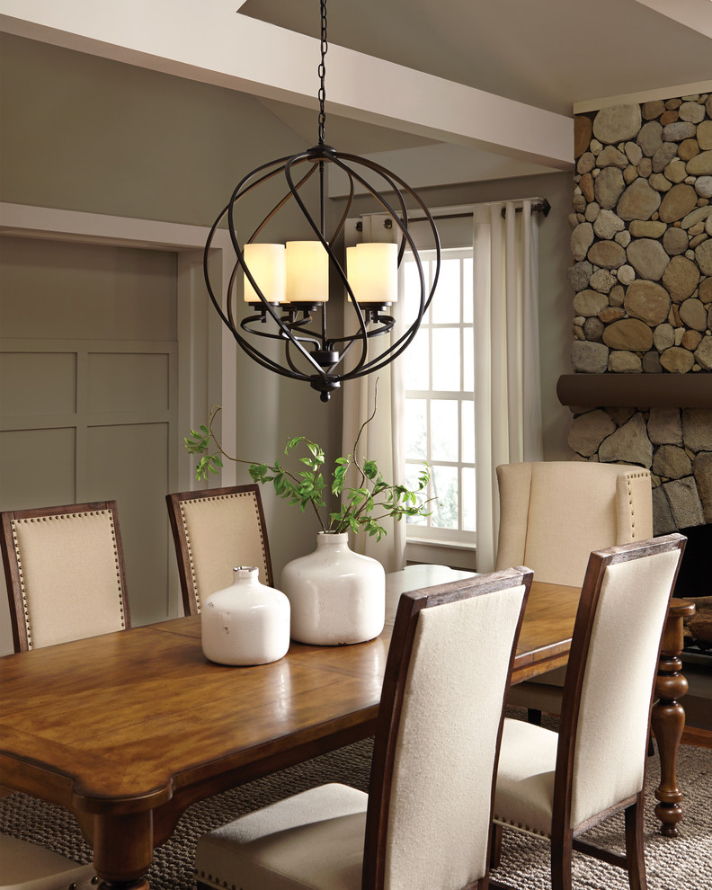 Traditional dining room in Other with grey walls, light hardwood floors, a standard fireplace and a stone fireplace surround.