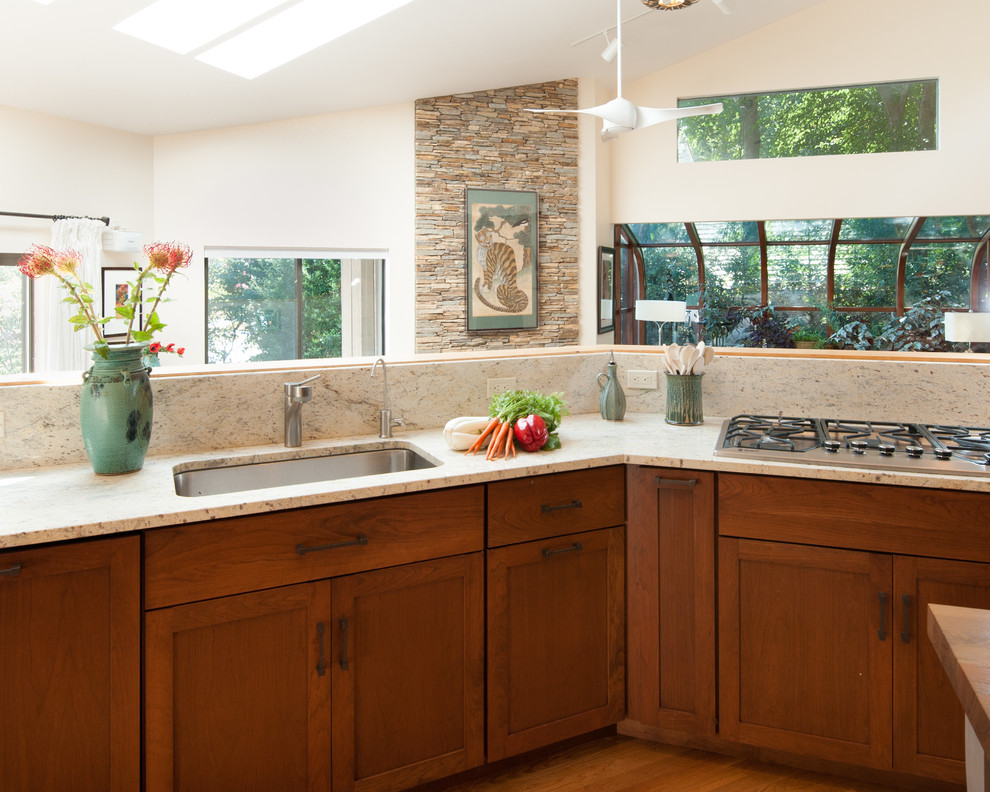 Inspiration for a large transitional kitchen remodel in DC Metro with an undermount sink, shaker cabinets, granite countertops, stainless steel appliances and an island