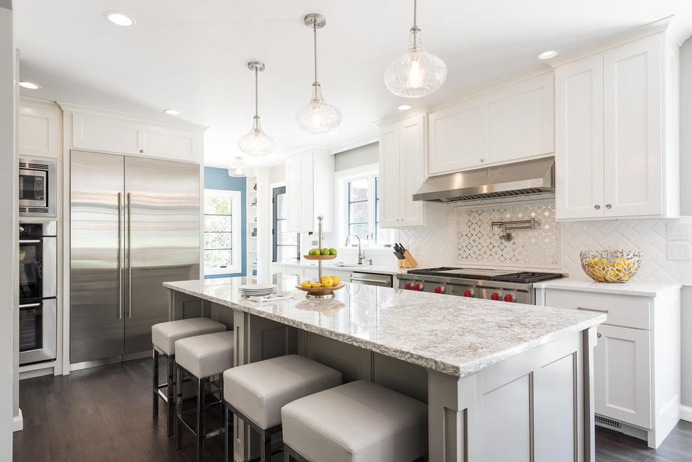 Inspiration for a transitional kitchen in Salt Lake City with an undermount sink, shaker cabinets, white cabinets, metallic splashback, stainless steel appliances, dark hardwood floors and with island.