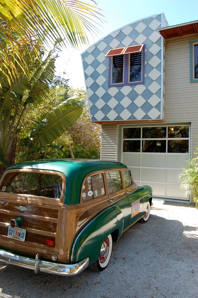 Photo of an eclectic exterior in Tampa with mixed siding.