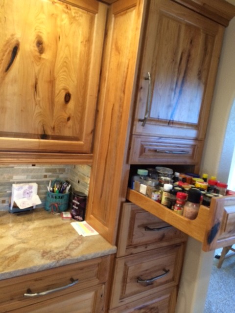 Traditional kitchen in Denver with raised-panel cabinets, multi-coloured splashback and glass tile splashback.