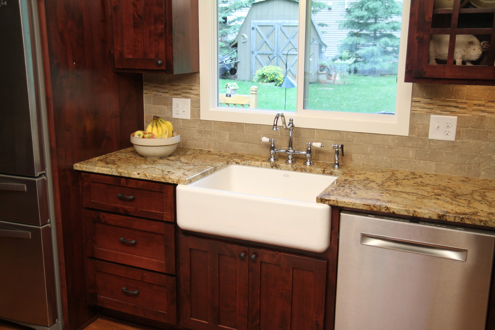 Inspiration for a rustic kitchen remodel in Minneapolis with a farmhouse sink, flat-panel cabinets and medium tone wood cabinets