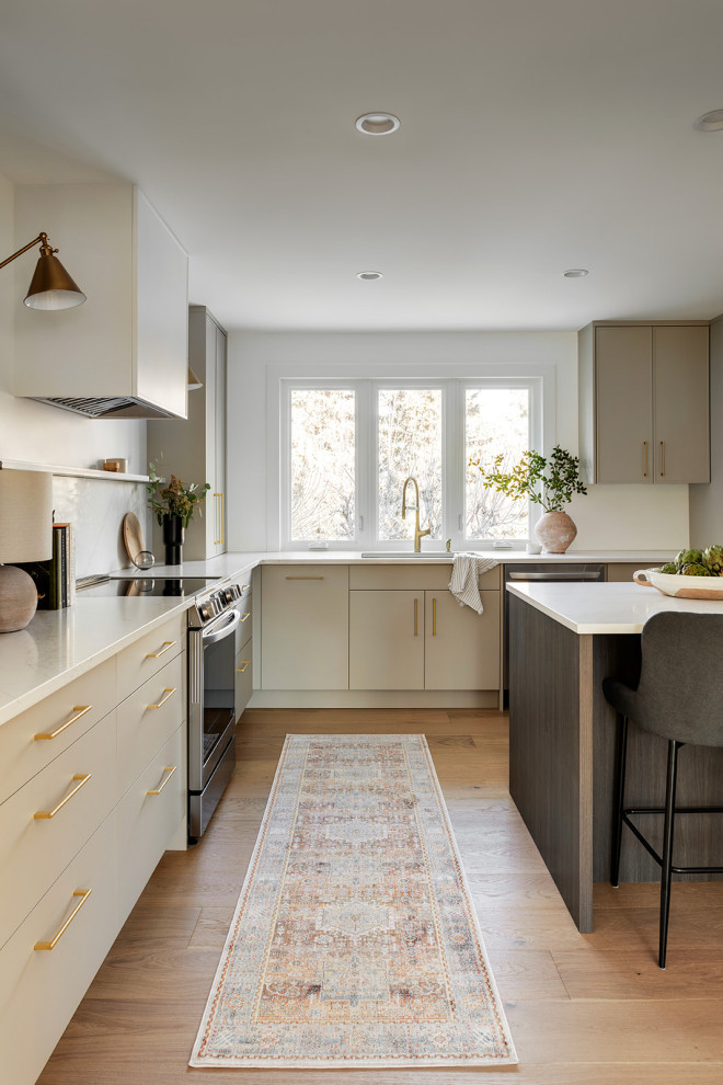 Example of a transitional kitchen design in Calgary