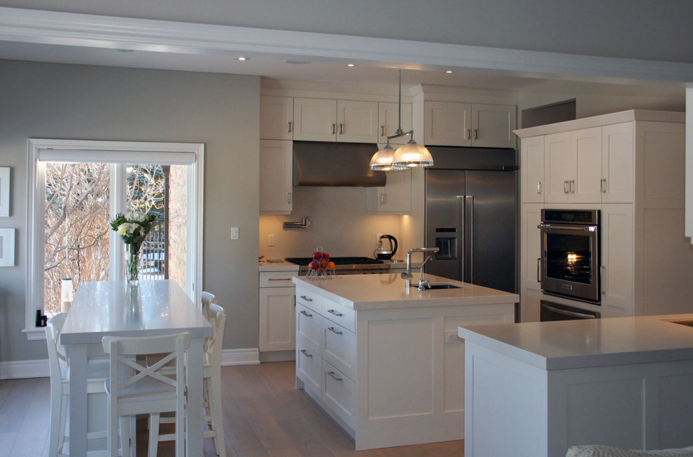 Example of a transitional kitchen design in Toronto