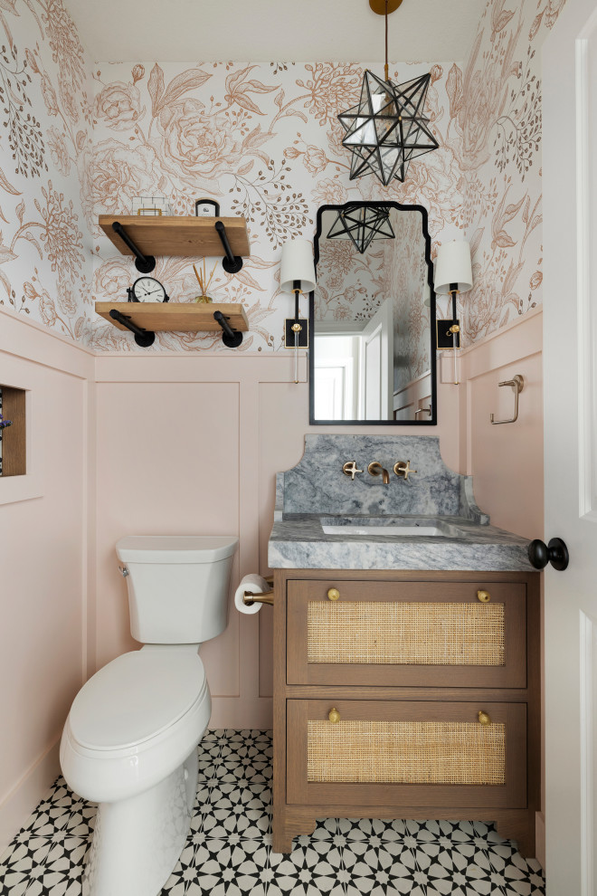 This is an example of a small bathroom in Minneapolis with flat-panel cabinets, brown cabinets, a two-piece toilet, pink tiles, wood-effect tiles, pink walls, marble flooring, an integrated sink, granite worktops, white floors, grey worktops, a single sink, a freestanding vanity unit and wallpapered walls.