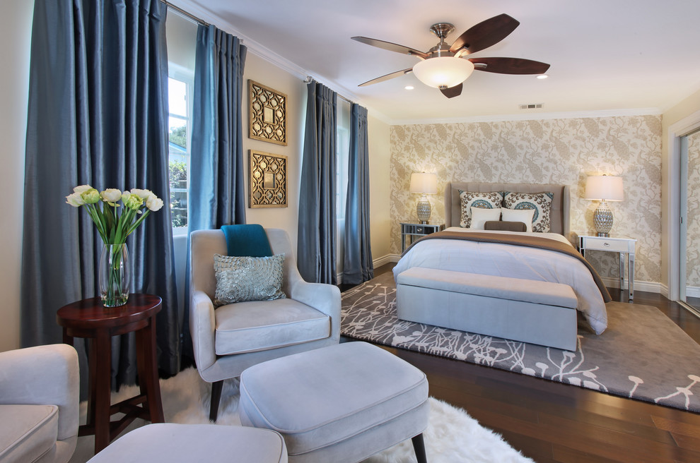 Beach style master bedroom in Orange County with beige walls and dark hardwood floors.