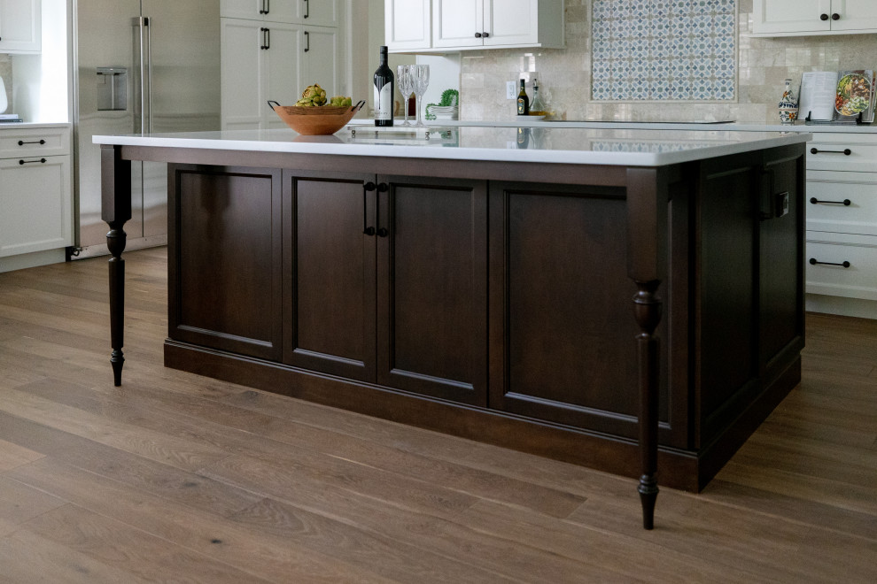 Inspiration for a transitional kitchen remodel in Orlando with white cabinets, marble countertops, multicolored backsplash, stone tile backsplash, stainless steel appliances and white countertops